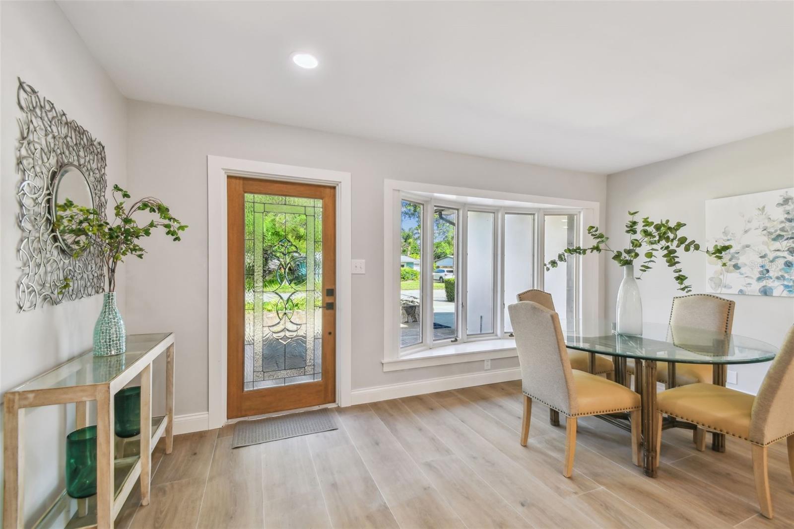 High ceilings and wood tile floors help transform this old into new!