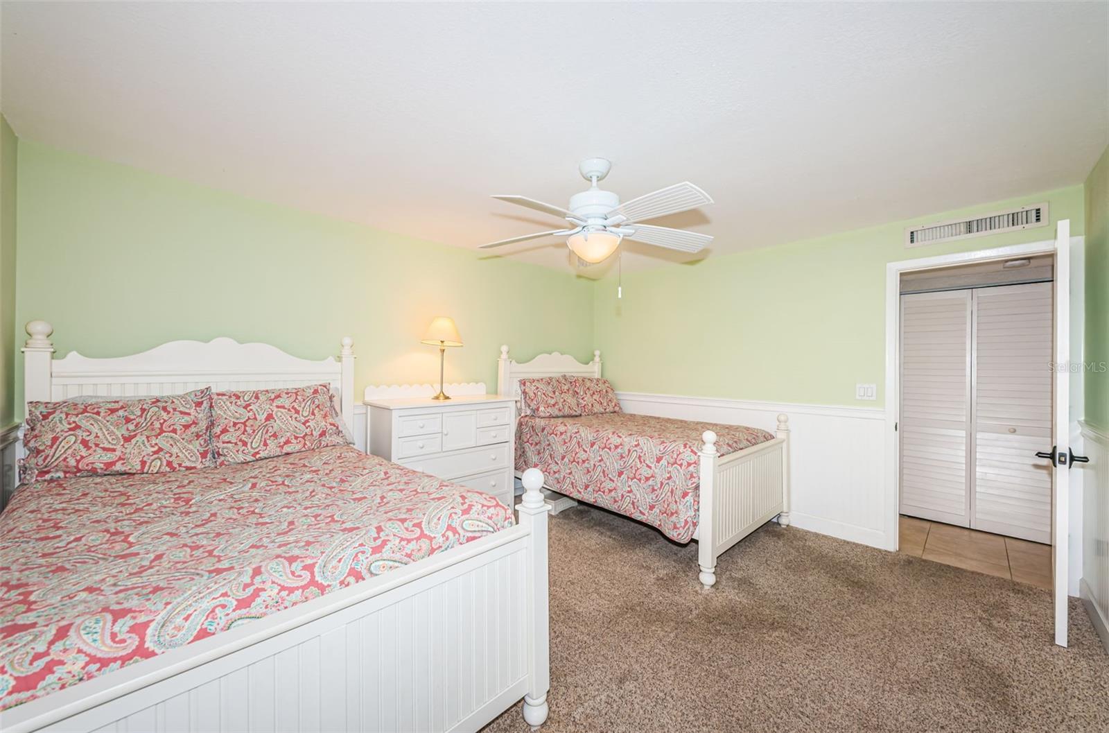 Another view of the spacious second bedroom - door on the right is to the hall to the second bath