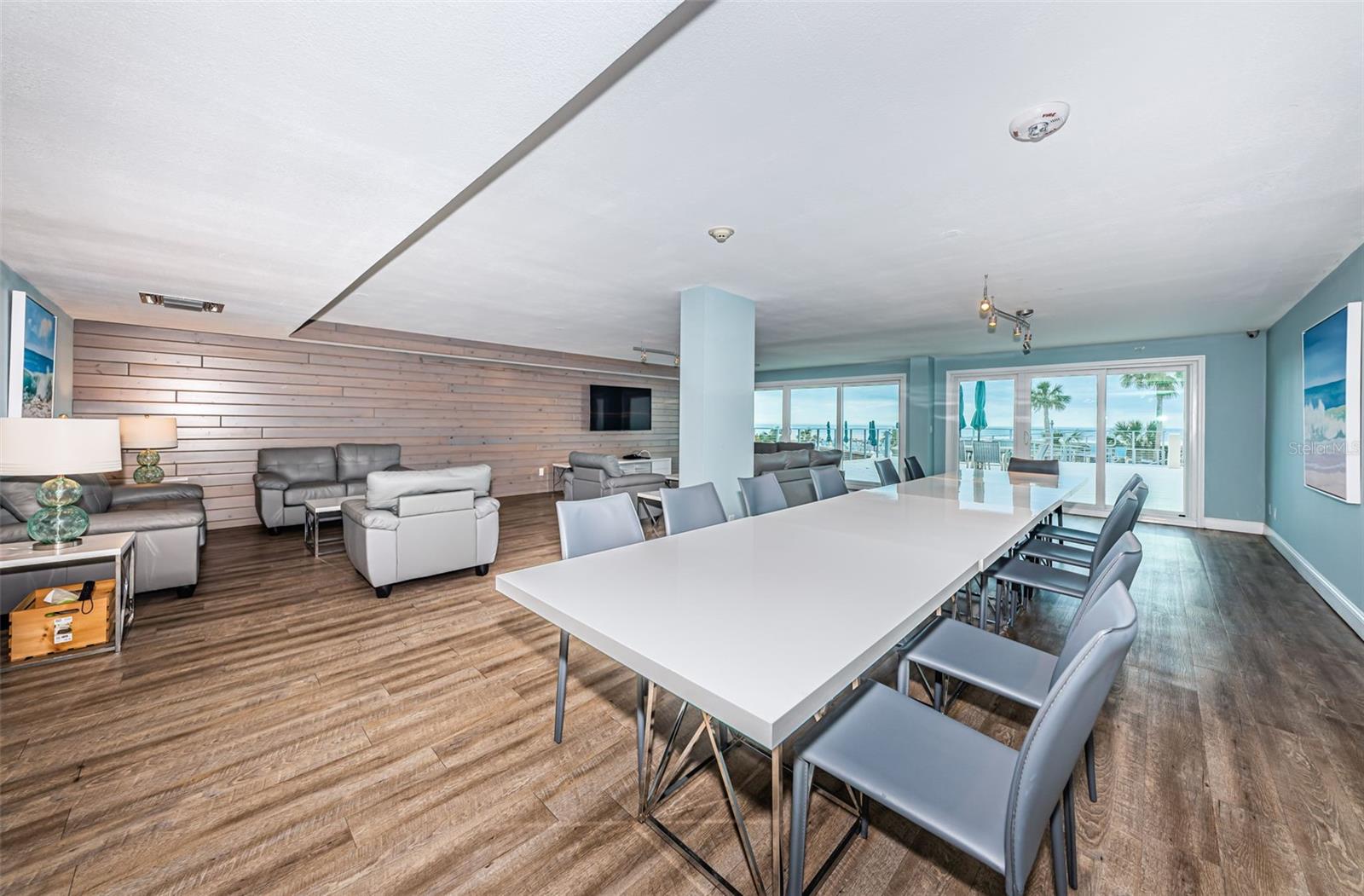 Community Room with sliders to the upper pool deck