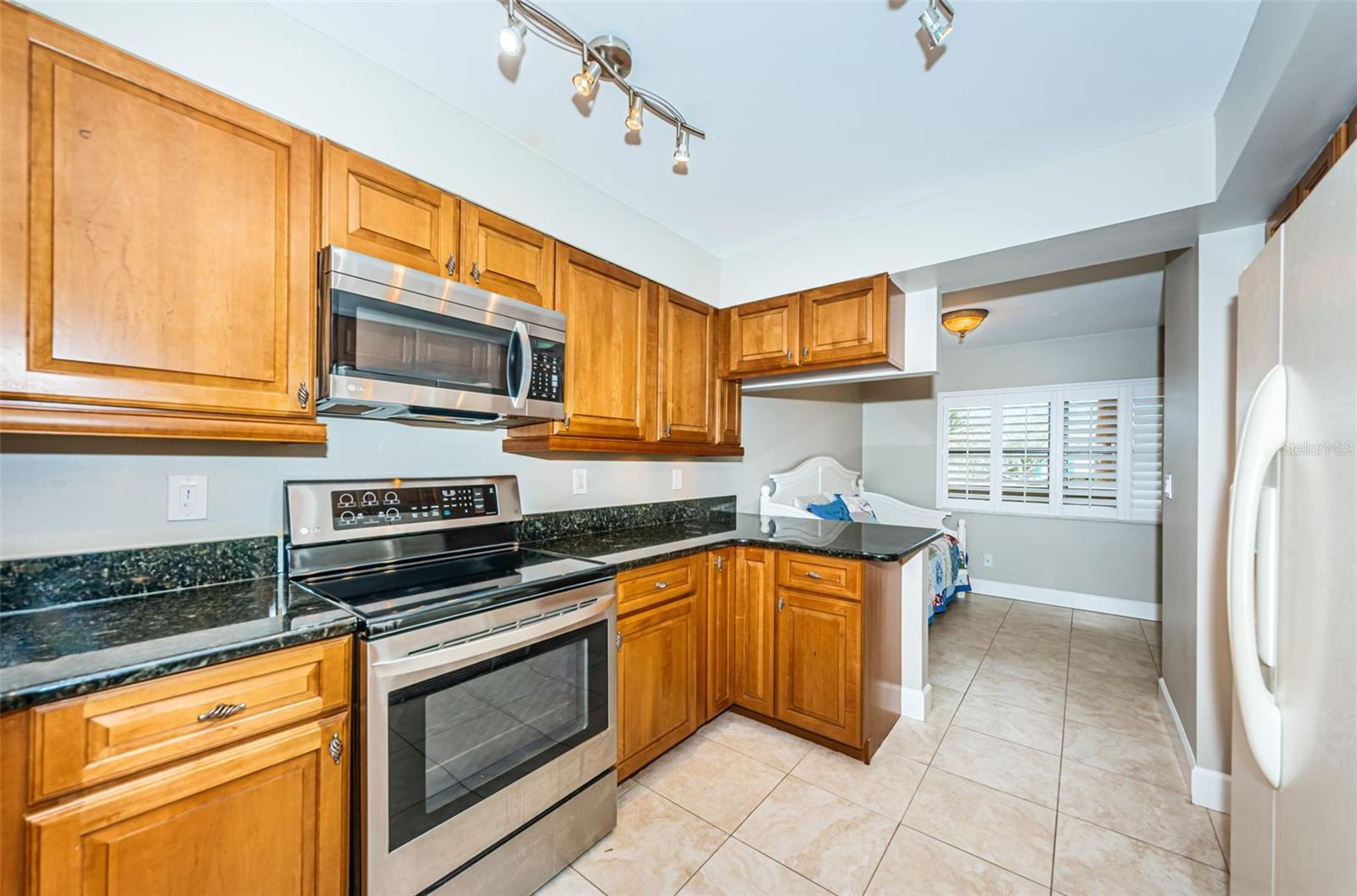 Kitchen showing the flex space that can be a dinette, home office or extra sleeping space