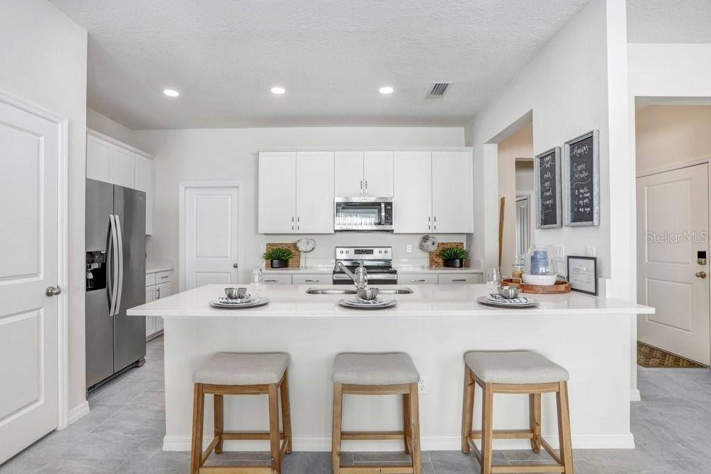 Kitchen with Quartz Countertops (photo of model home)