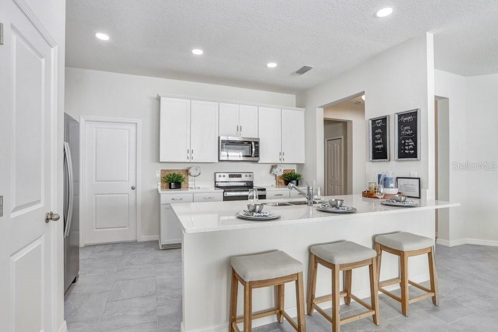 Convenient Kitchen Eating Bar! (photo of model home)