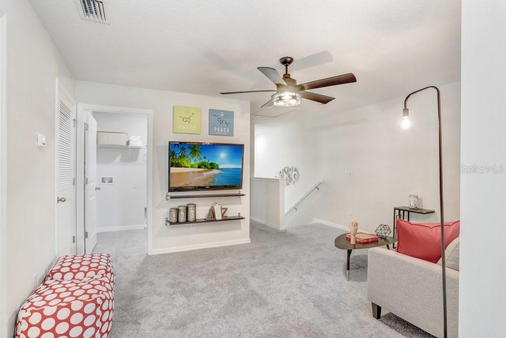 Secondary Entertainment area in Upstairs Loft! (photo of model home)