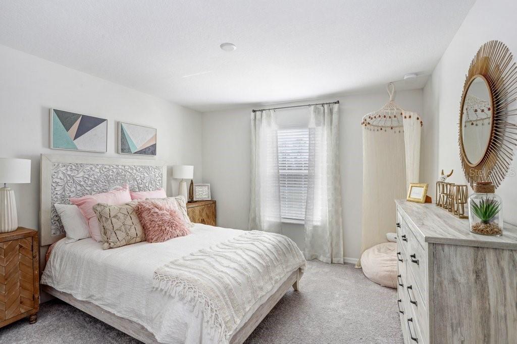 Spacious Bedroom 2 (photo of model home)