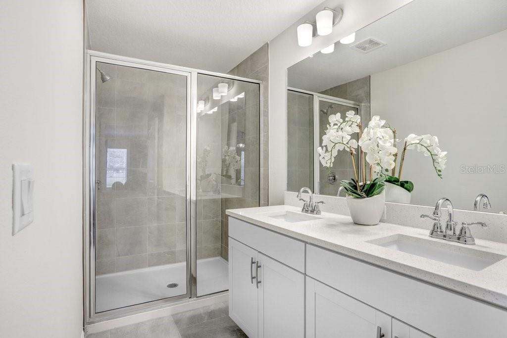 Primary Bath with Shower! (photo of model home)
