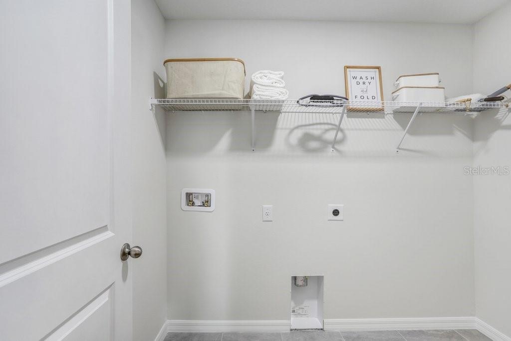 Convenient Laundry with Room for Storage! (photo of model home)