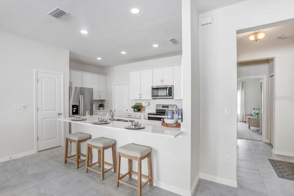 Convenient Kitchen Eating Bar! (photo of model home)