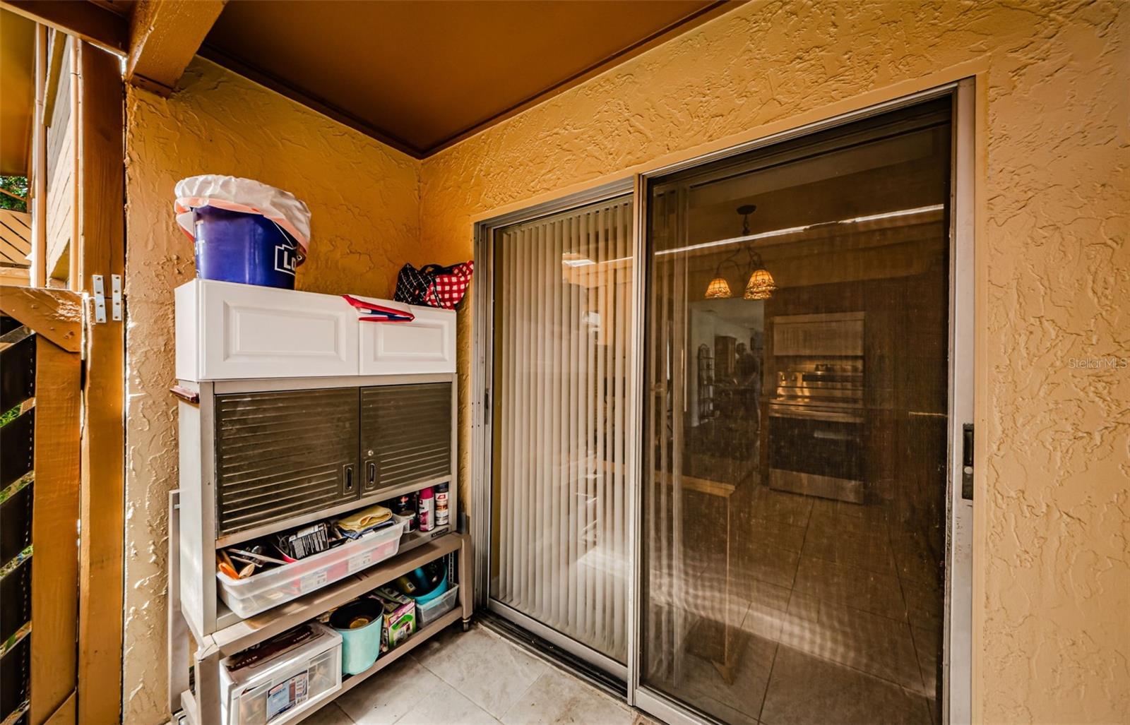 Lanai off the kitchen with covered carport access