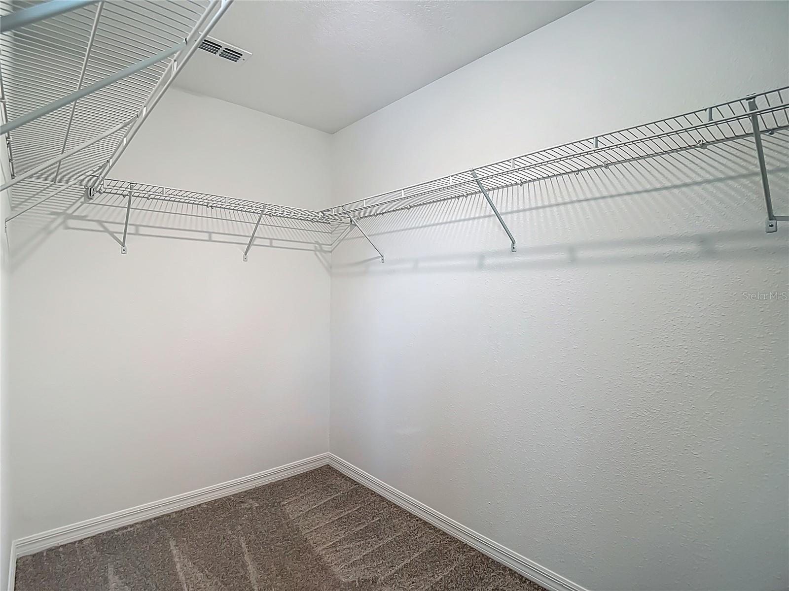 Primary Bedroom's Expansive Walk-In Closet
