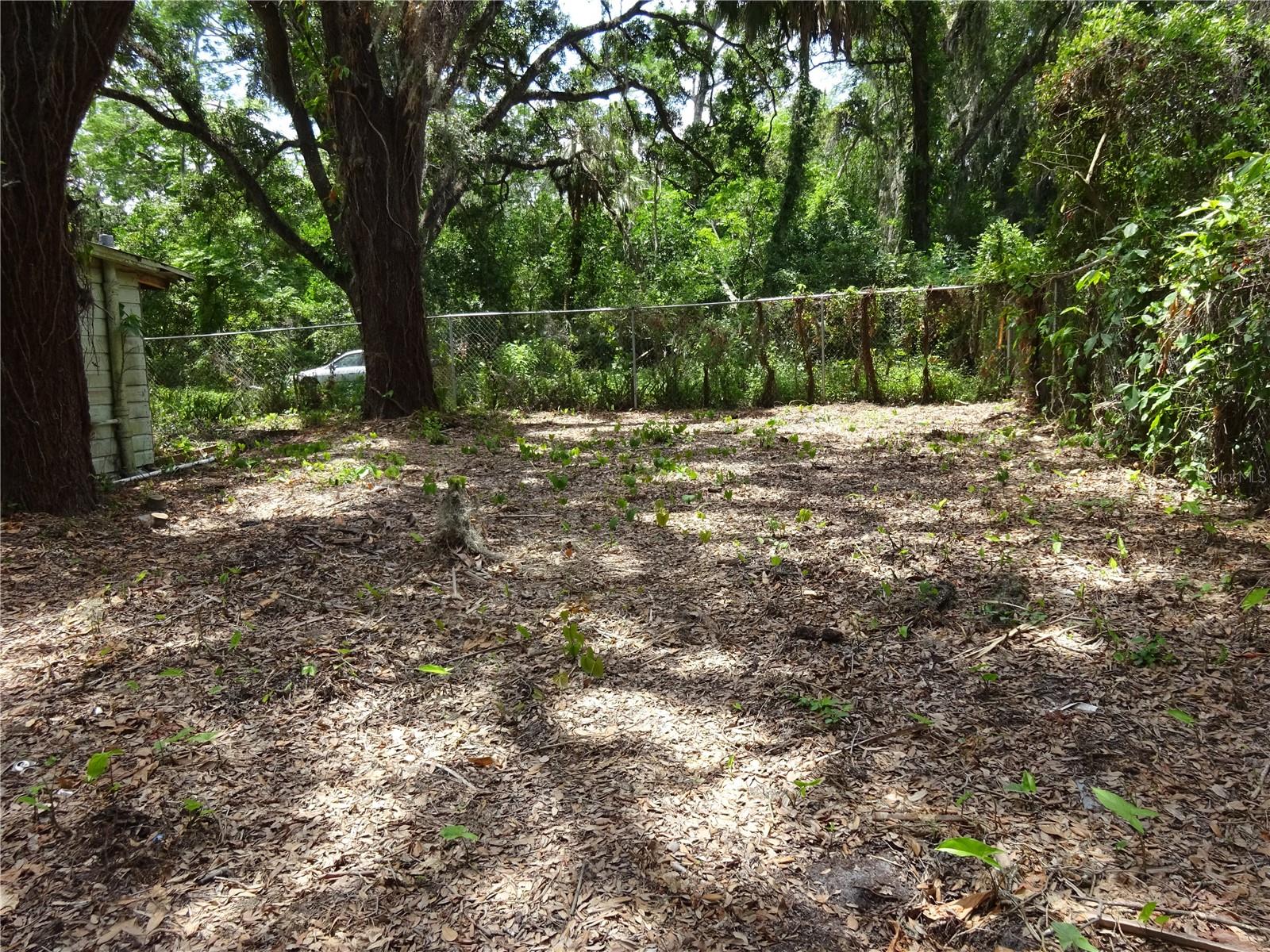 The septic tank is located on the right side of the home.