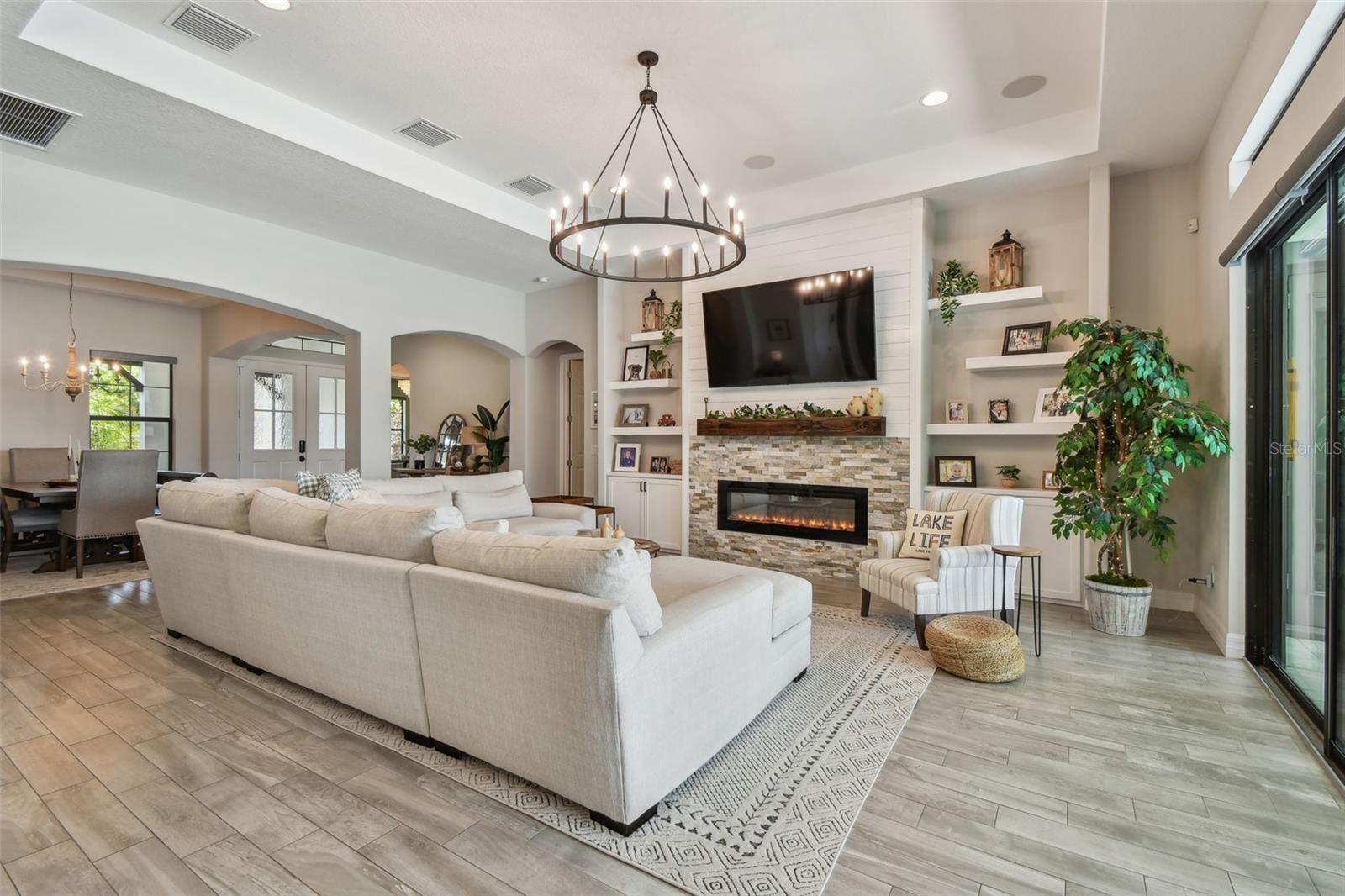 Great Room with Fireplace, built in cabinets and floating shelves