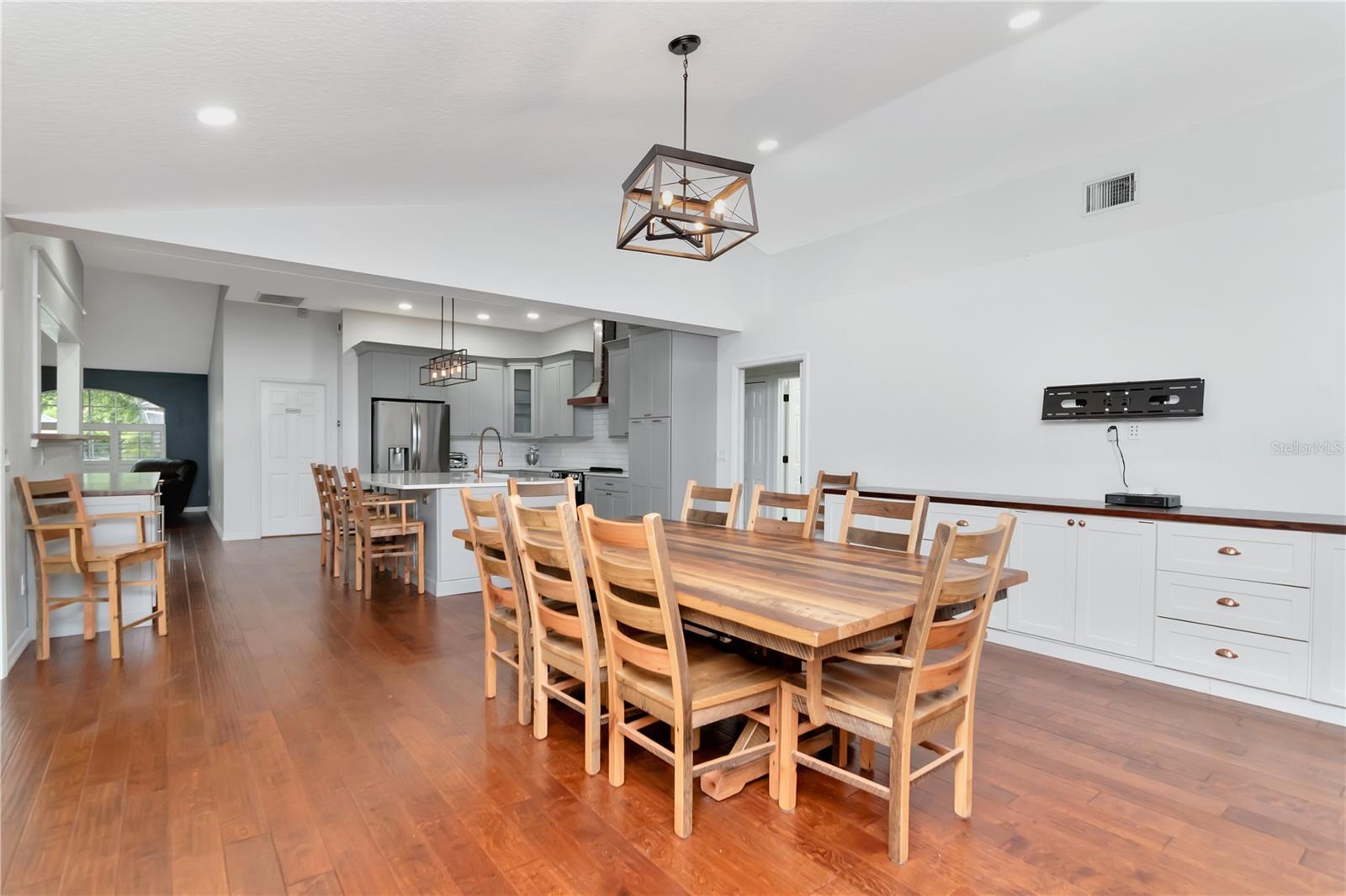 Large Family Room - Currently used for Diningroom with Built Ins and Wood Burning Fireplace with Lanai/Pool Access