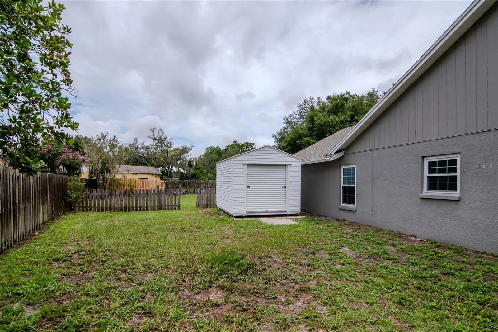 Side Yard separately fenced in with Shed