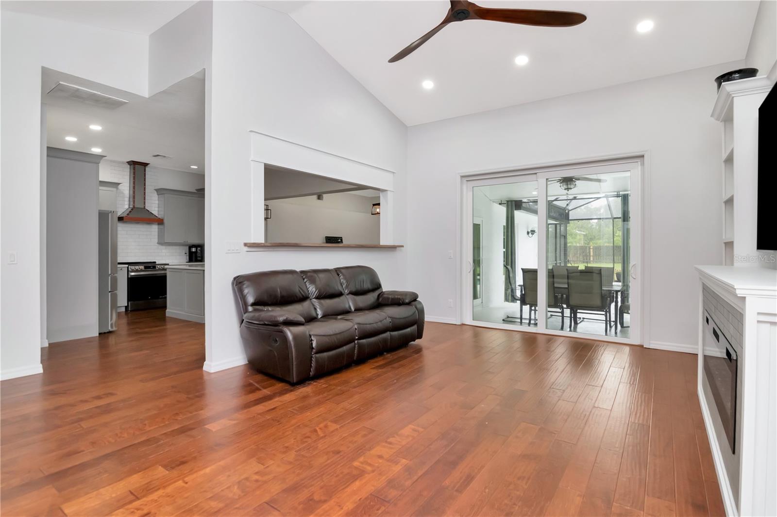 Livingroom with Custom Built Ins and Lanai Access