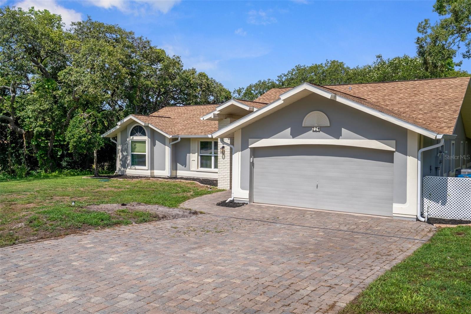 Brick Pavers lead from driveway to the front door