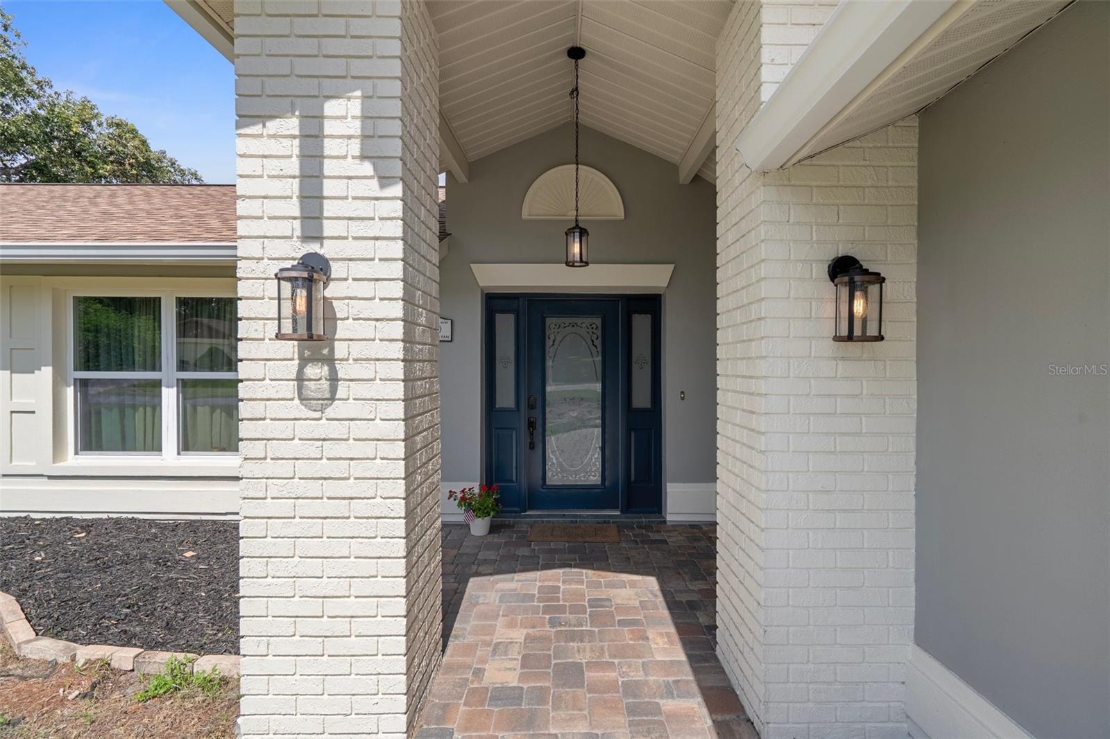 Welcoming foyer with coat closet and extra storage.