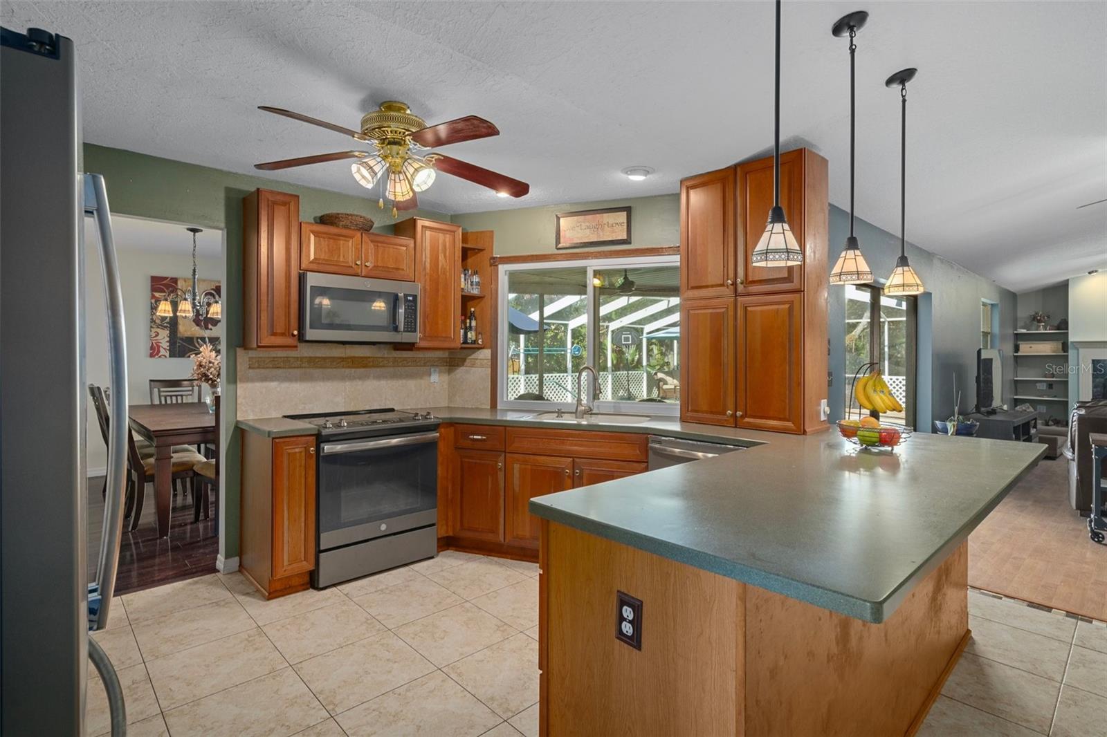 All stainless appliances with pass through to the pool/patio area.