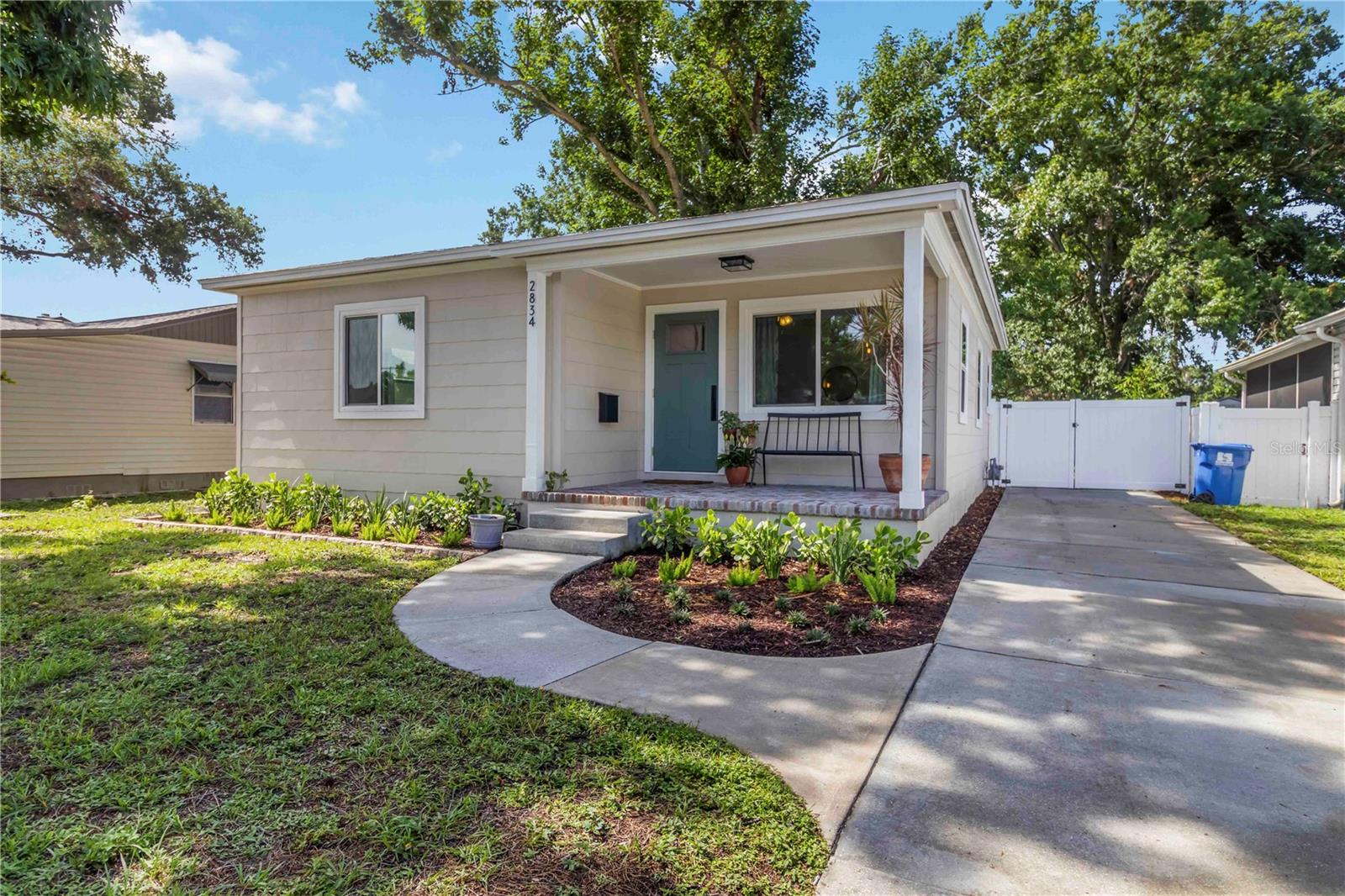 Adorable front porch to sit out and enjoy your morning coffee.