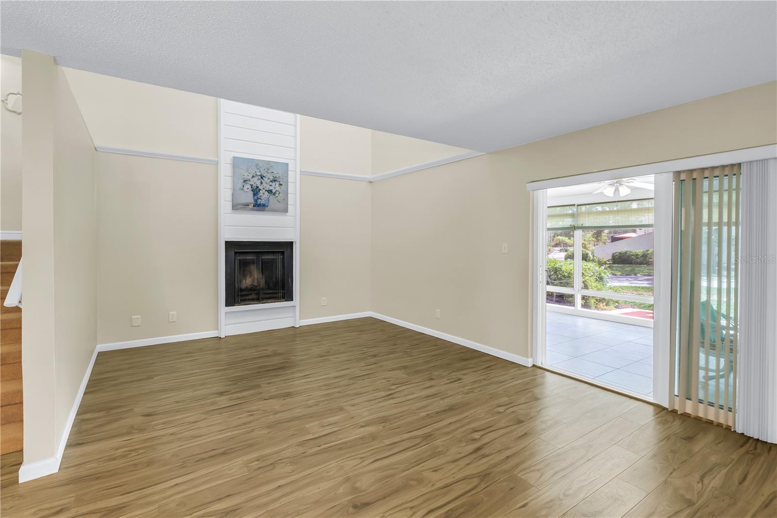 Living Room with Fireplace & Sliders to Florida Room