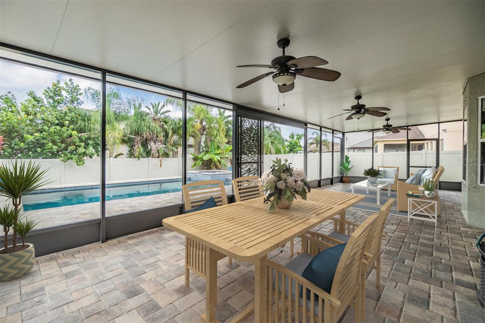 Oversized lanai with pool view. Virtually staged