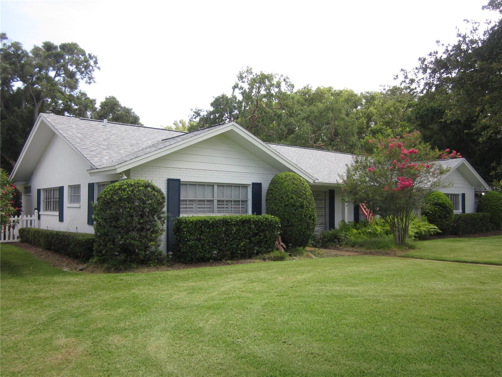 Alt. view of this beautiful home's exterior & manicured landscaping