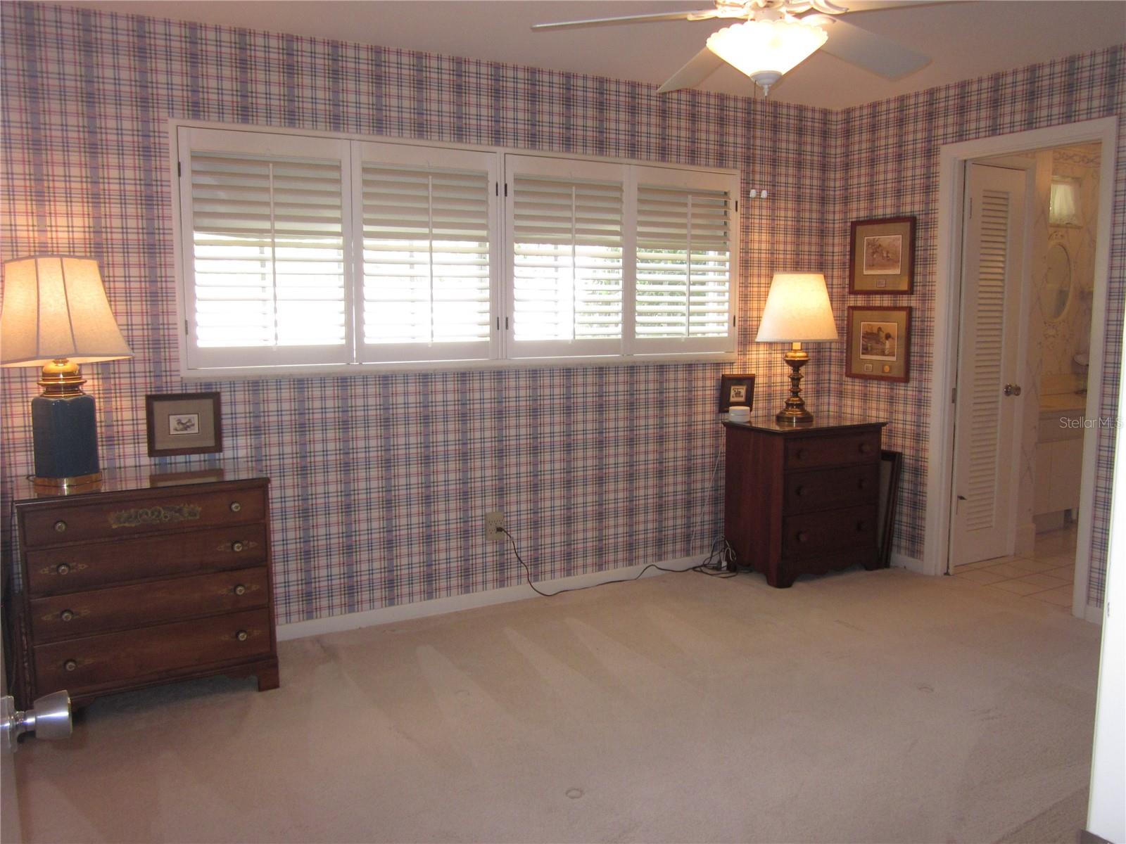 Bedroom #3 with adjacent "Jack & Jill" bath. Note: plantation shutters throughout the home