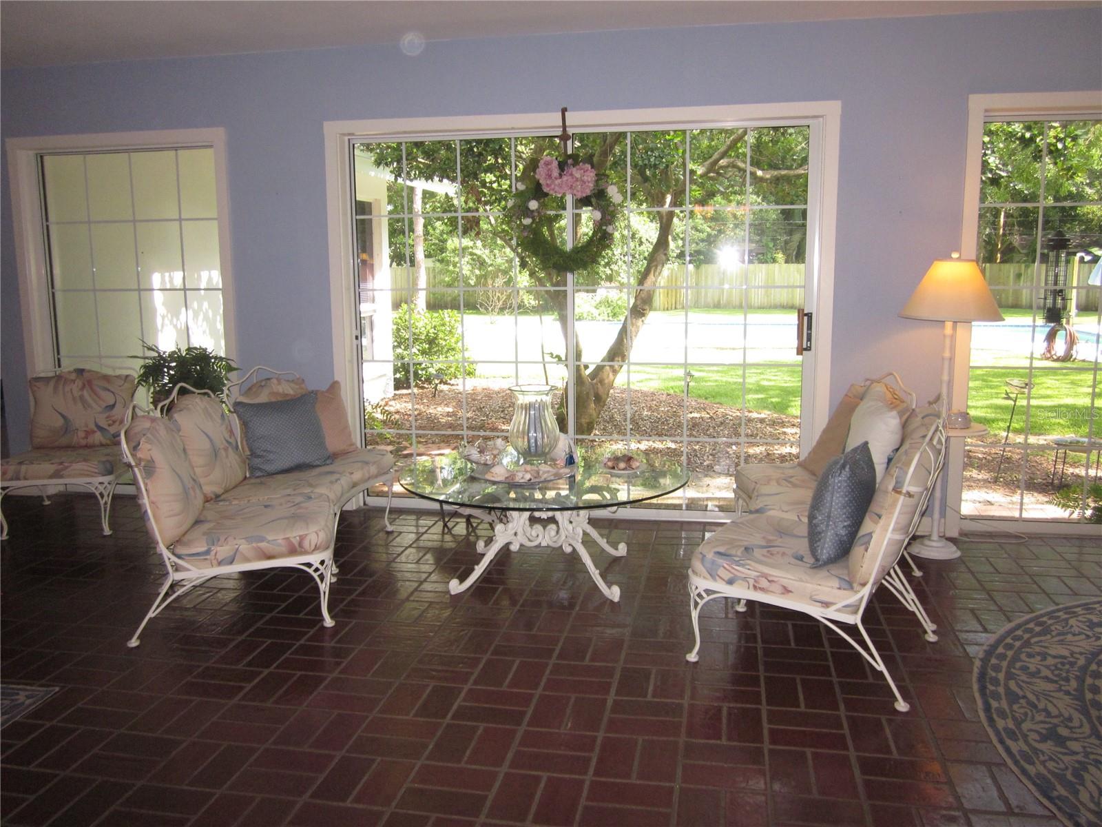 Additional living space with great views of the back yard & pool