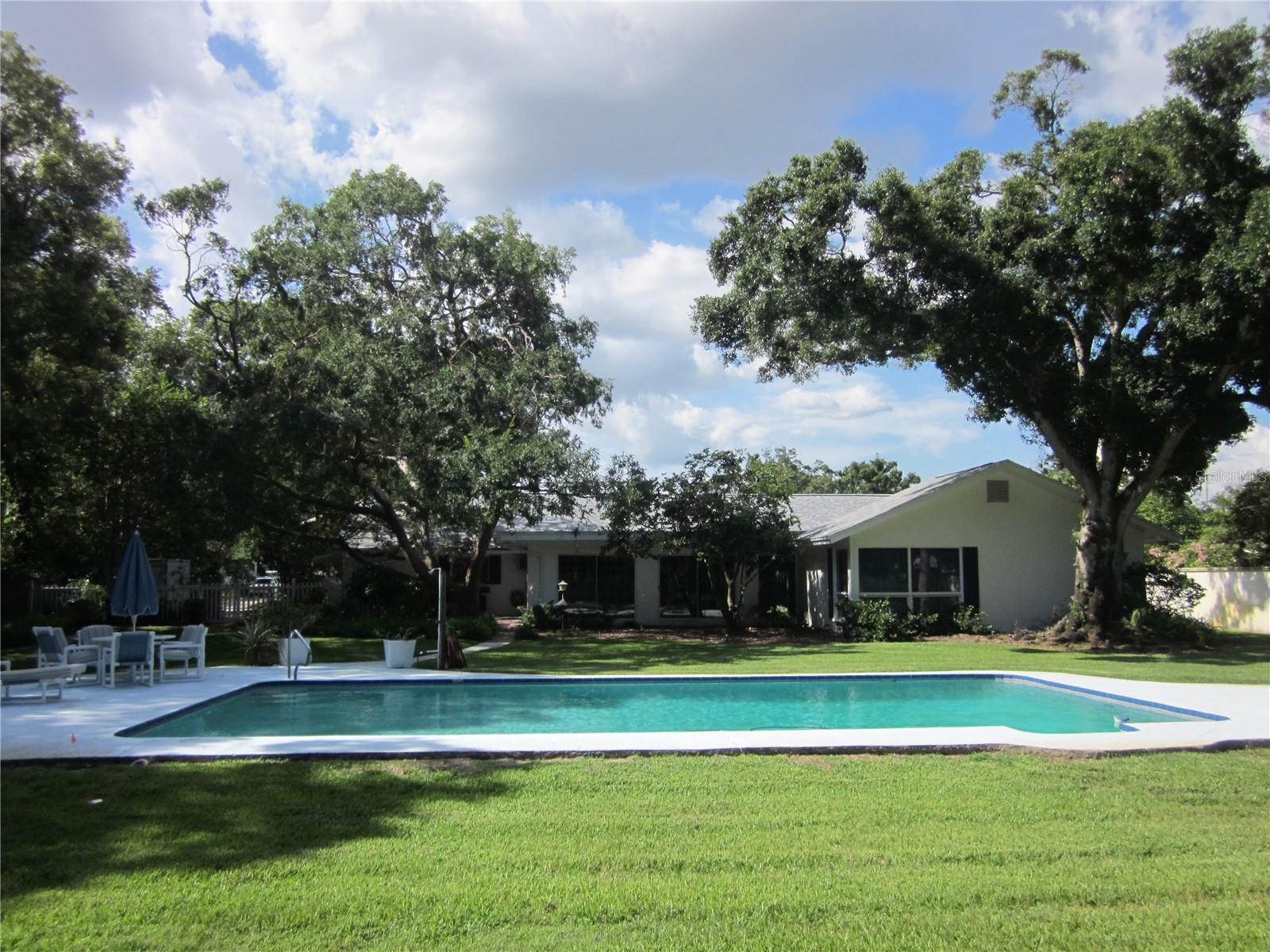 Back of the home & the incredible back yard & pool