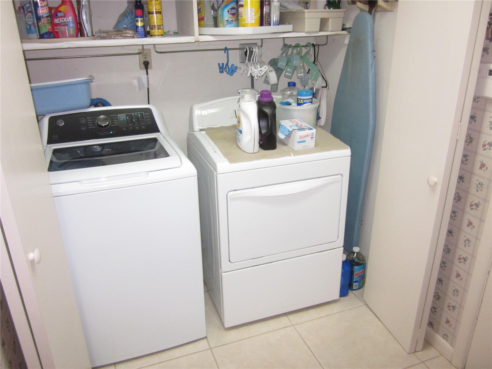 Inside washer & dryer in utility room off kitchen.