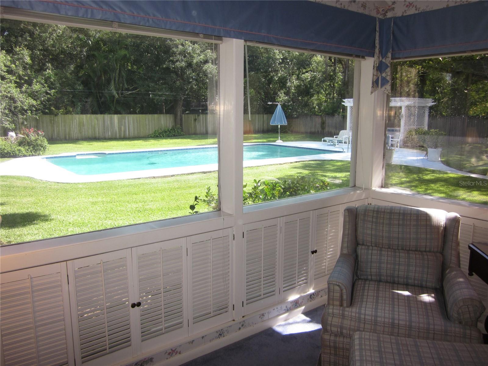 Back yard & pool as viewed from the primary/master bedroom