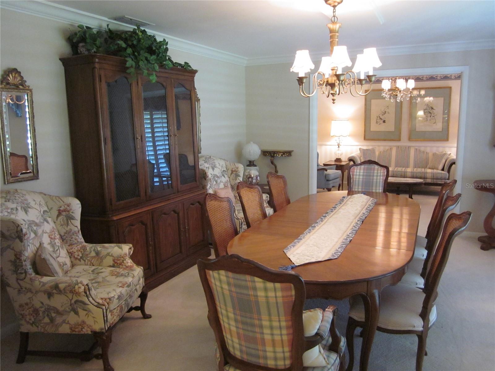 Formal dining room with crown molding