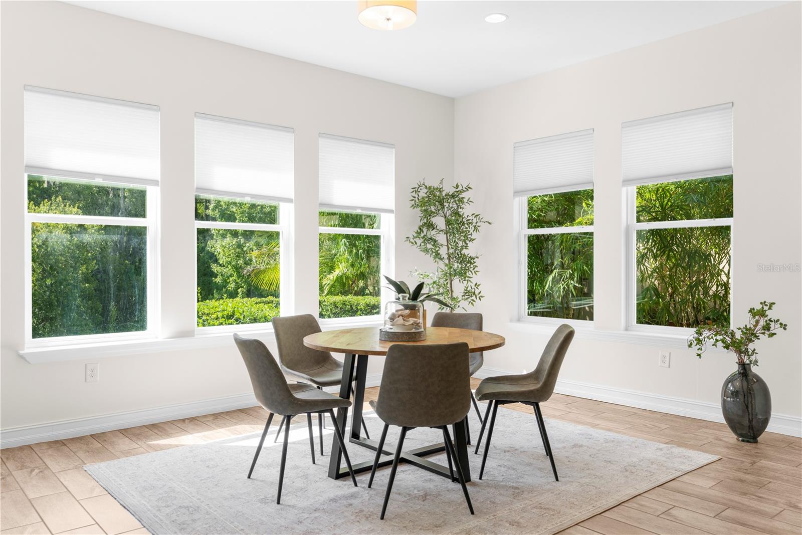 Informal dining room with views of greenery