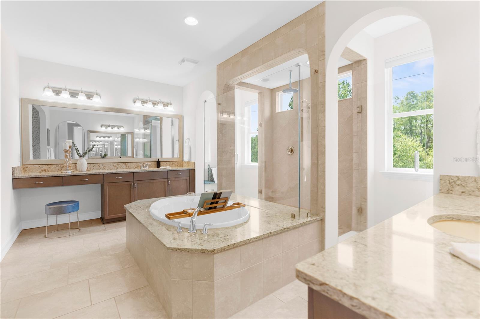 Oversized spa like master bathroom with dual vanities