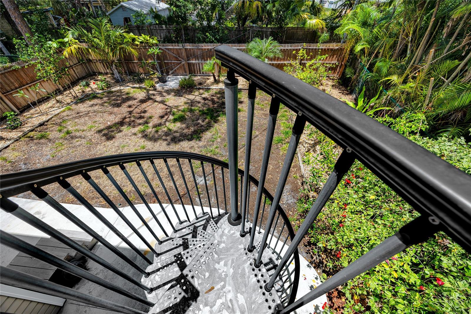 Spiral Staircase leading to yard from balcony