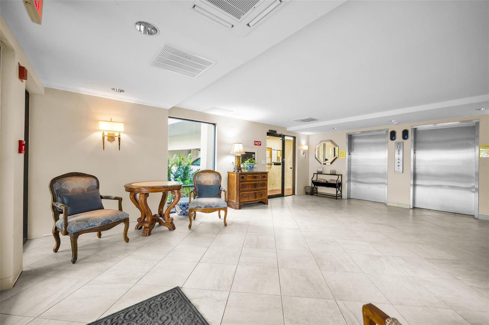 Secure lobby with access to elevators and under building parking area