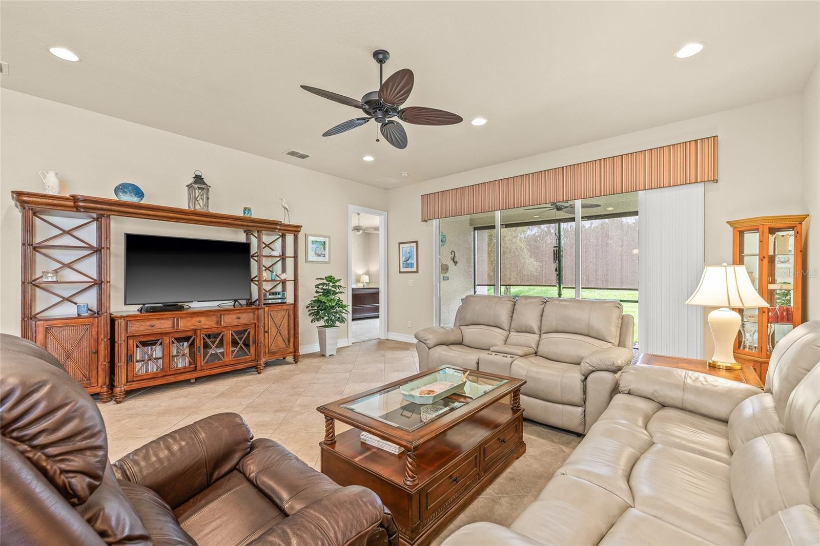Living Room Screened in Patio, other door leads to the Master Bedroom