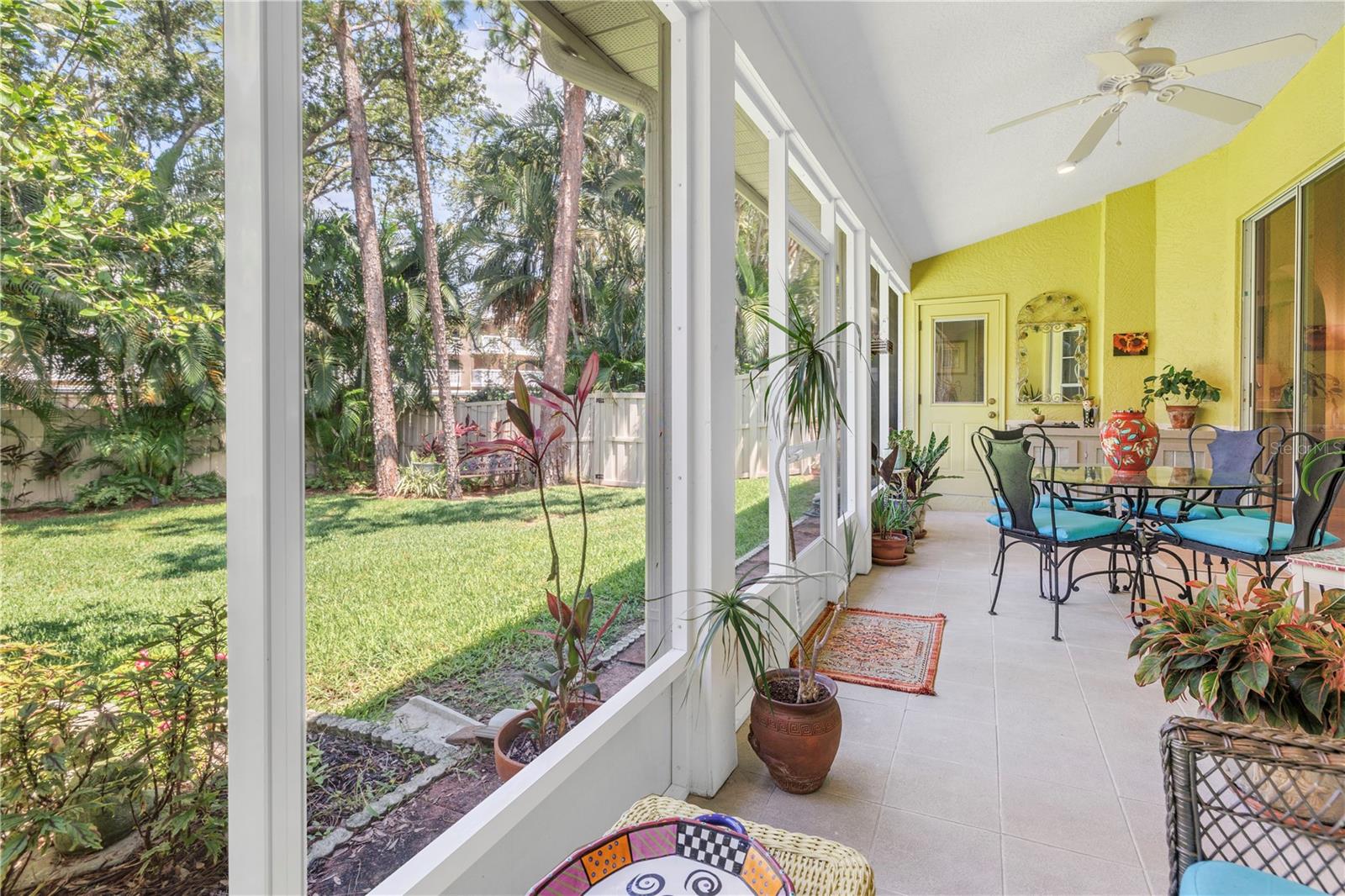 Both Living and Dining are accommodated by this long porch across the back of the home.