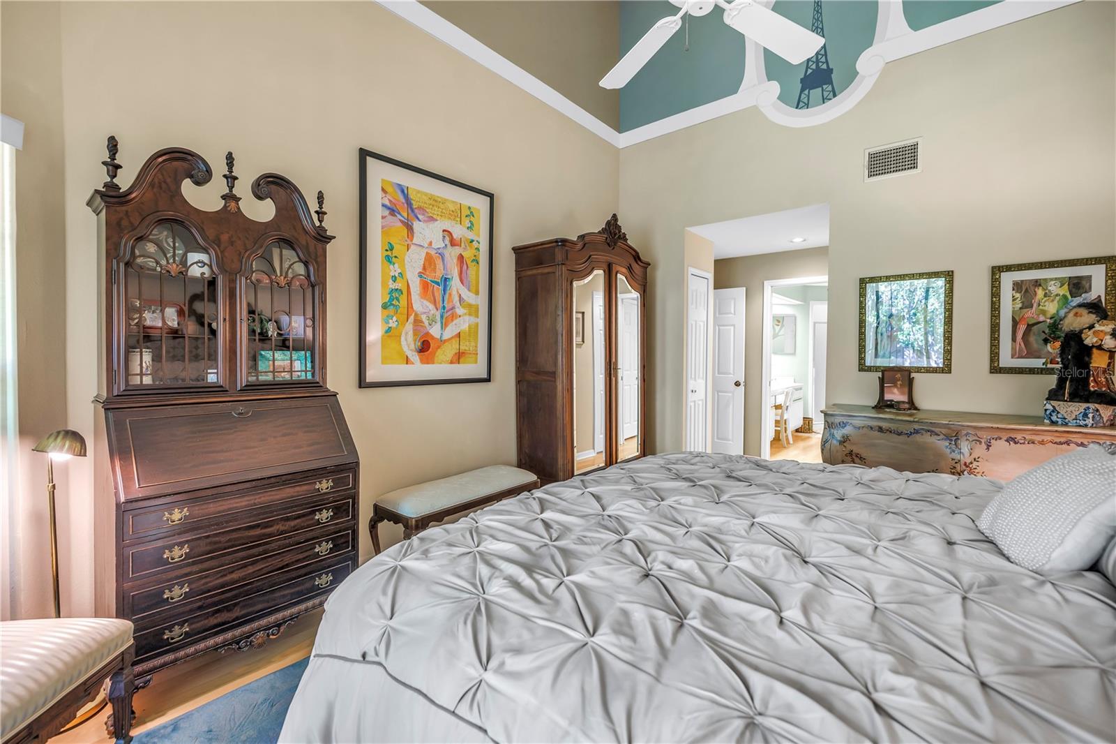High Vaulted Ceiling in the Primary Suite with a touch of Paris...C'est la vie!!