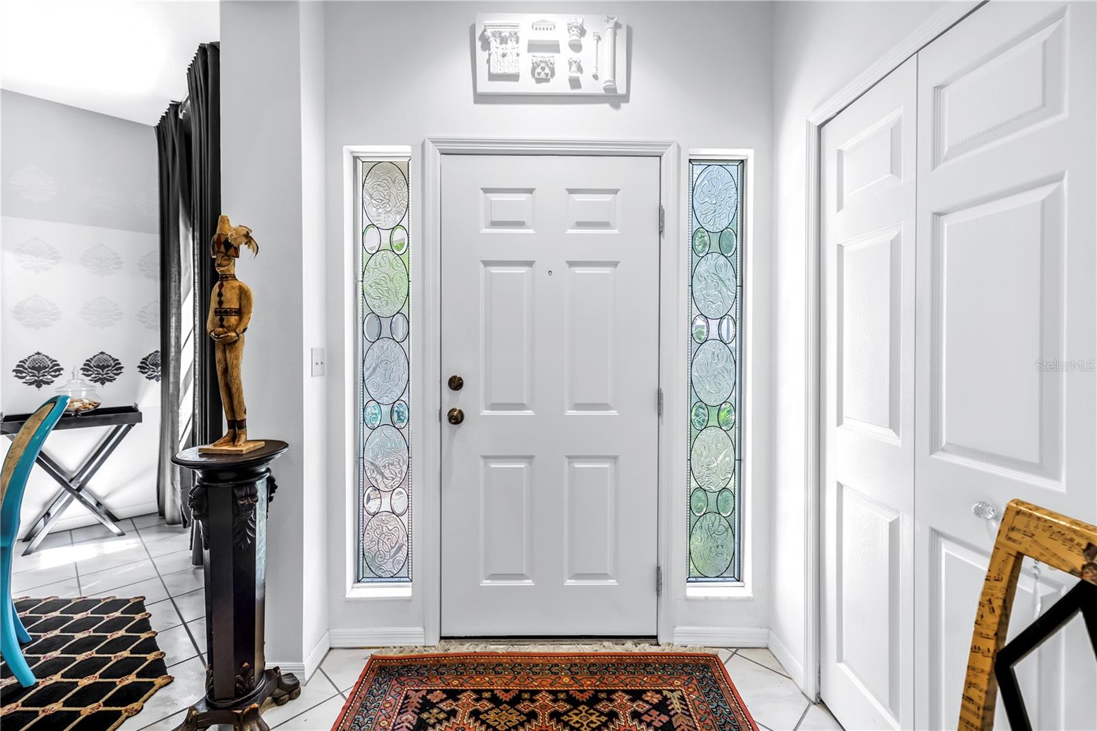 Fine Front Entry with Custom made Leaded Glass side lights at the door
