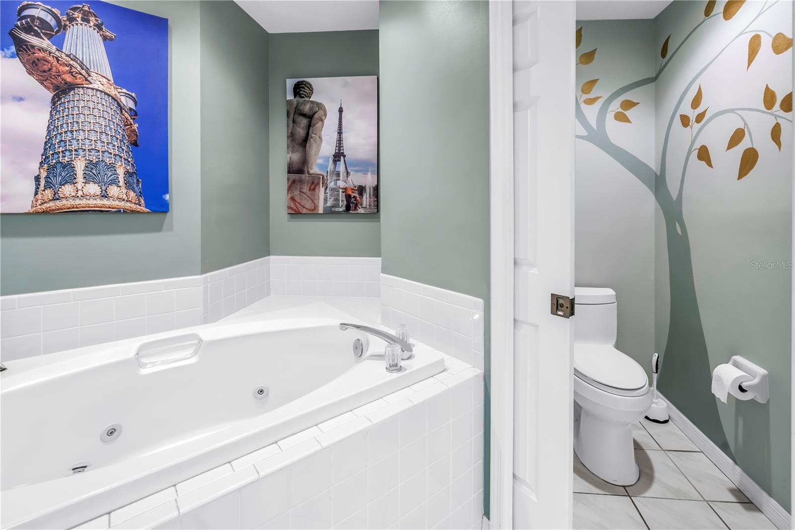 Private Toilet Closet with gold leaf mural.