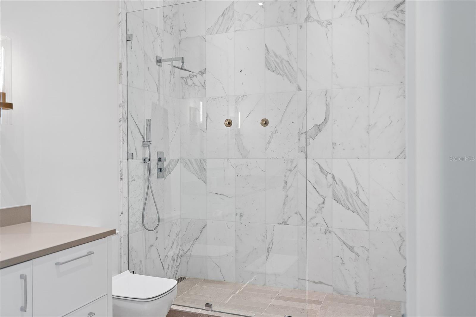 Polished Volakas marble shower