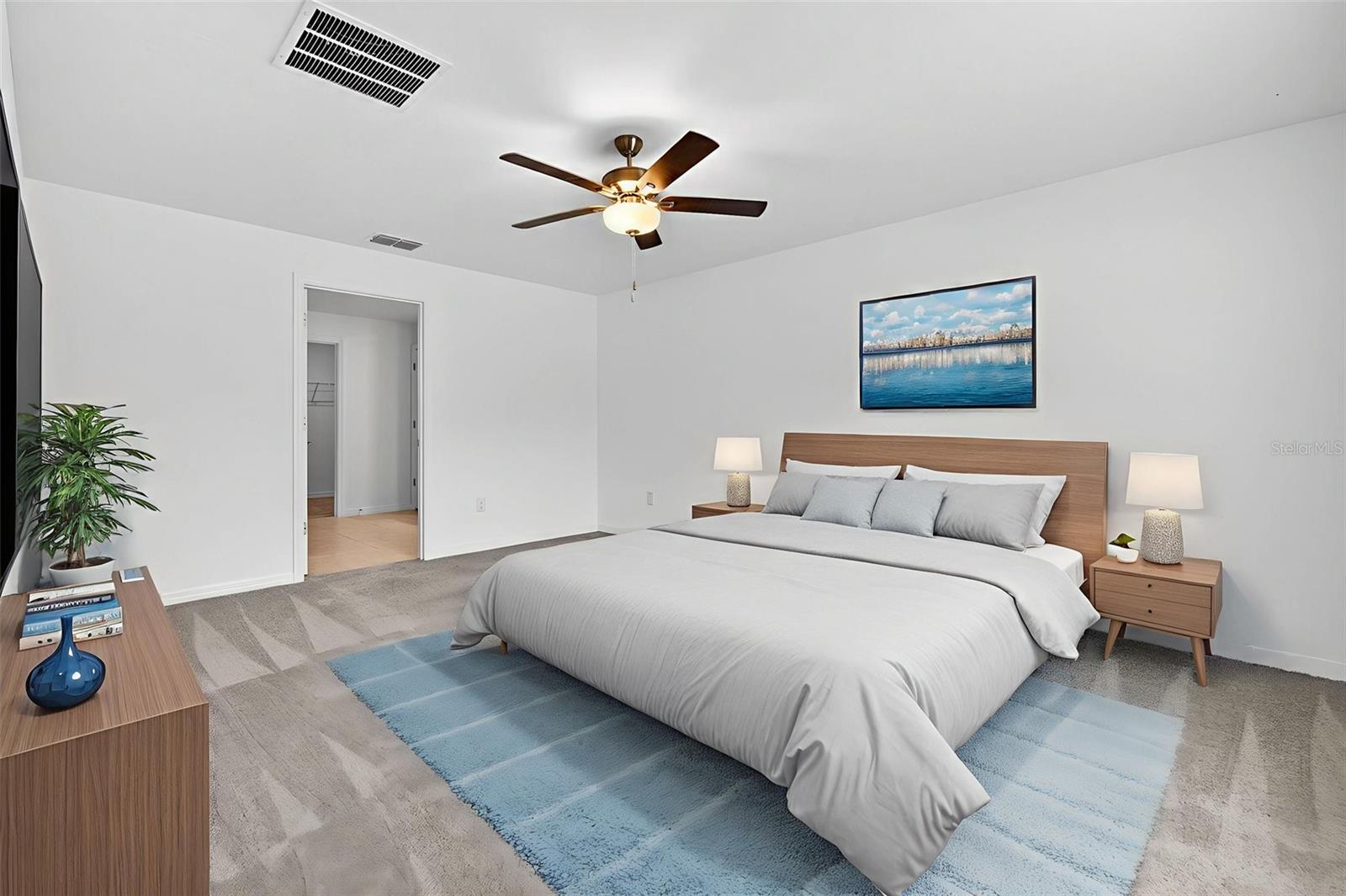 The primary suite is in the back of the property facing the back yard in a split floorplan from bedrooms 2/3/4.