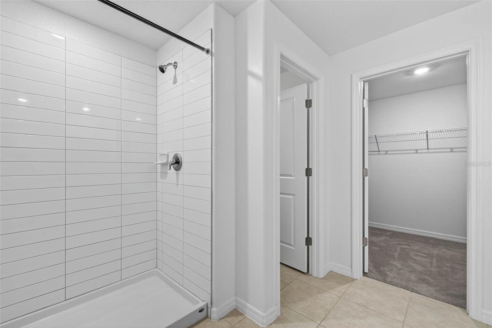 Walk-in shower to the primary