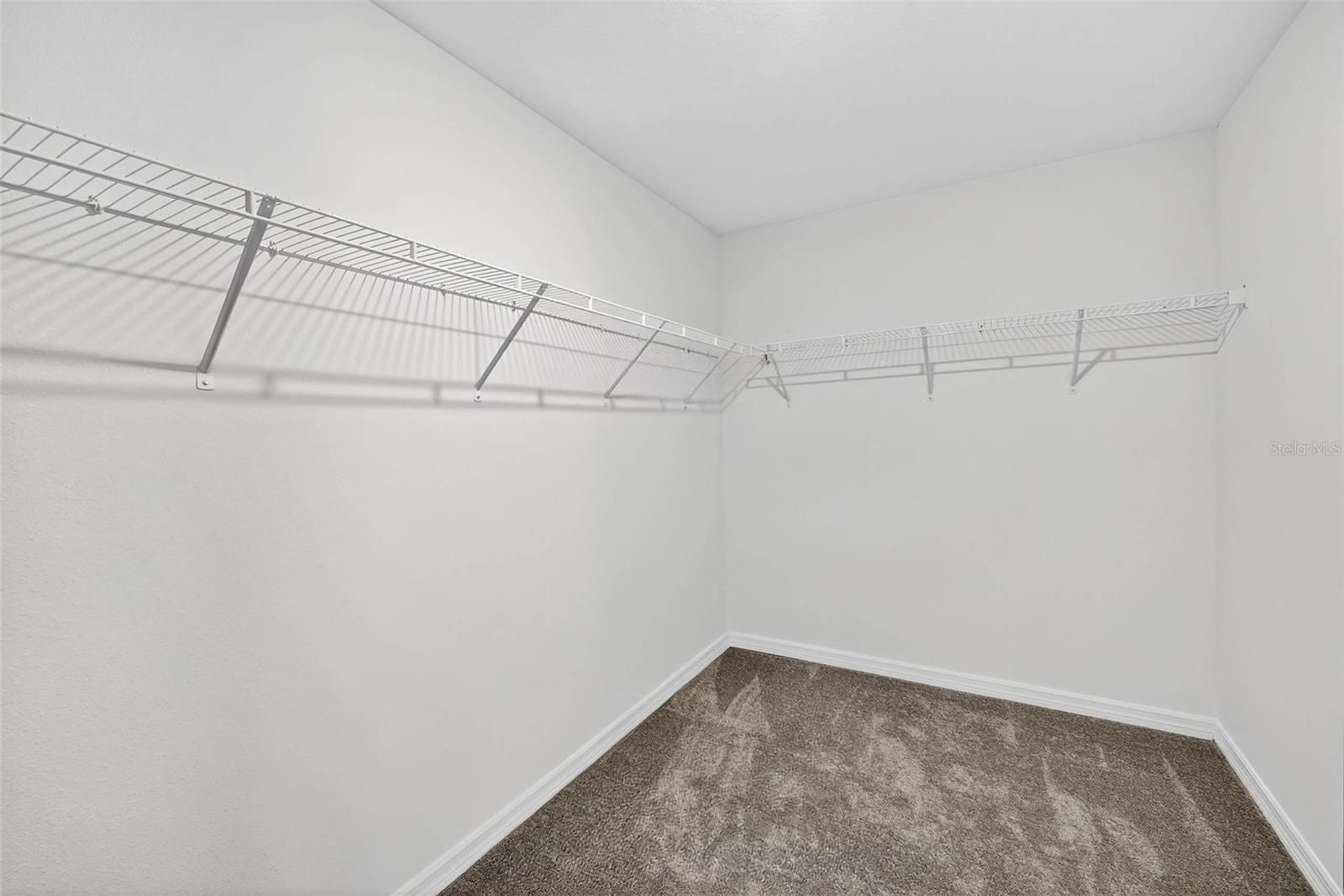 Walkin closet to the primary suite