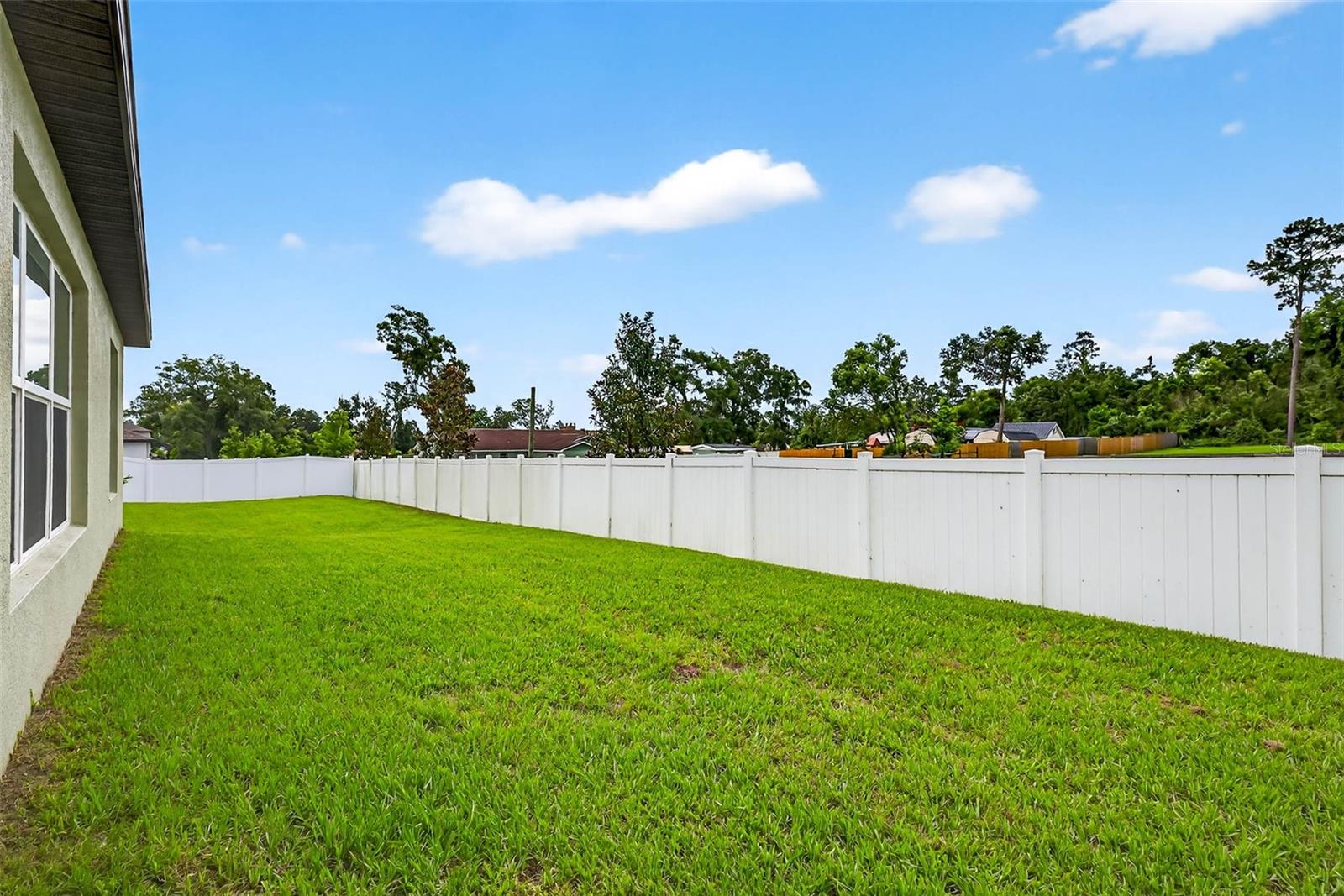 Large backyard with privacy fence already installed