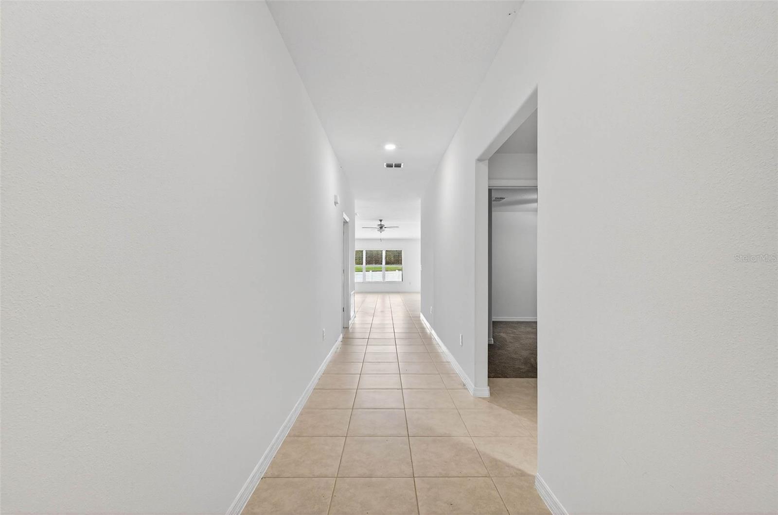 Fresh paint, tile flooring, tall ceilings- this property looks brand new!