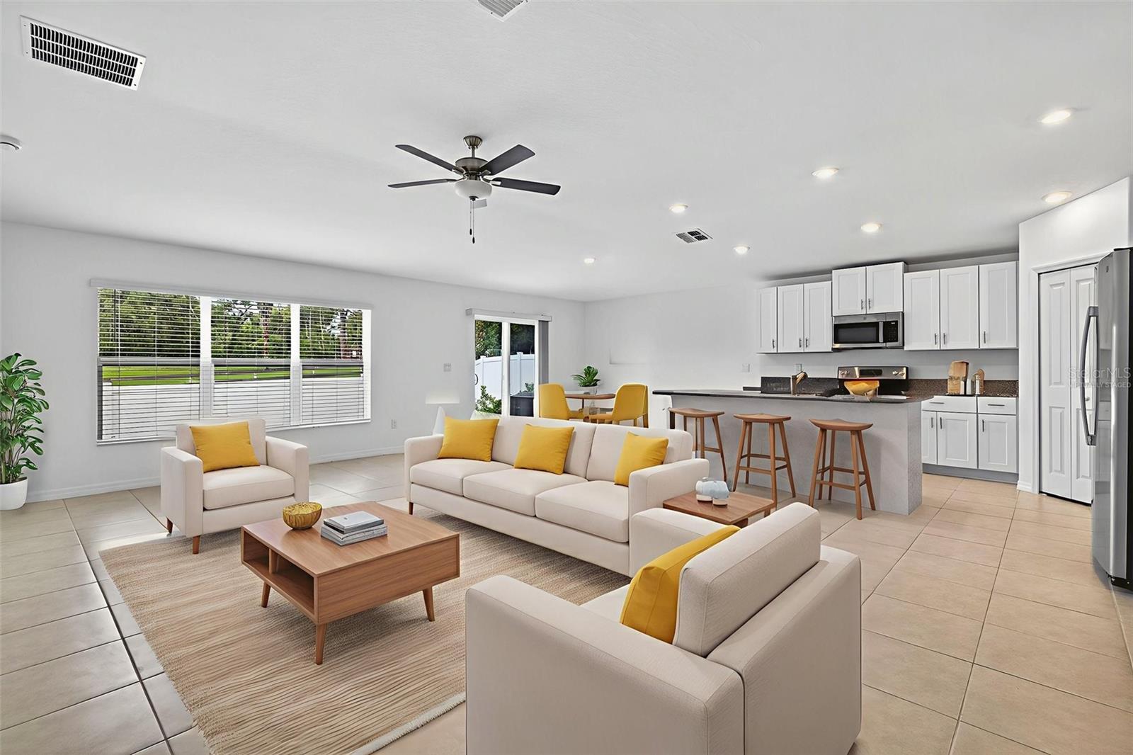 Virtually staged - this living room and open floor plan welcomes a number of different ways to set up your living space.