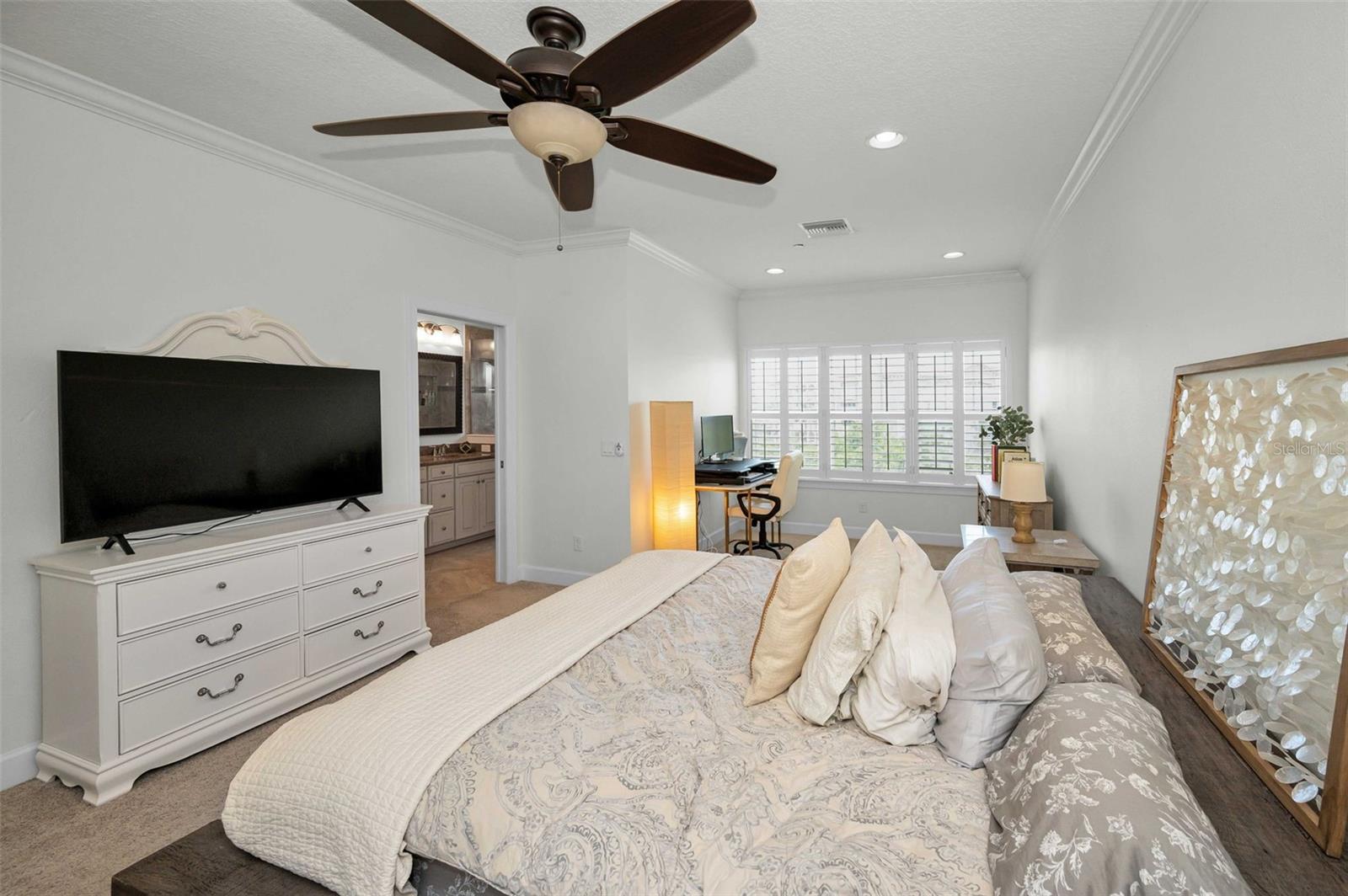 Upper level Primary Suite with sitting area overlooking the water!