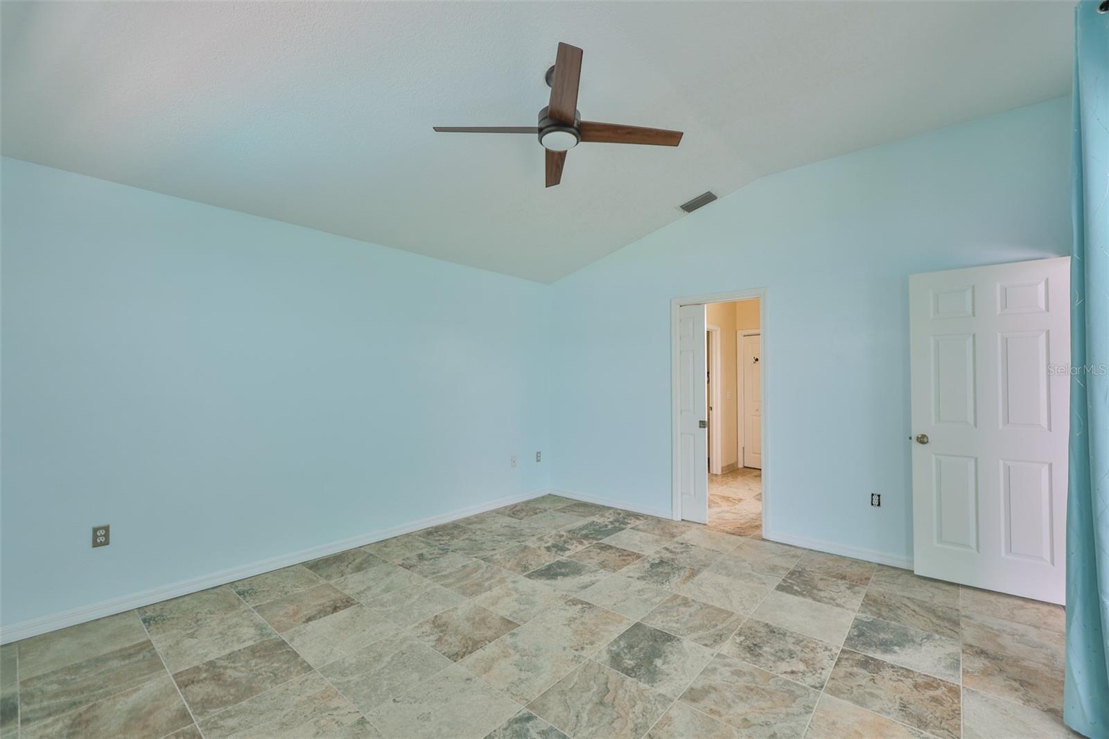 Primary bedroom, vaulted ceiling, sliders to lanai, only bedroom on this side of the home