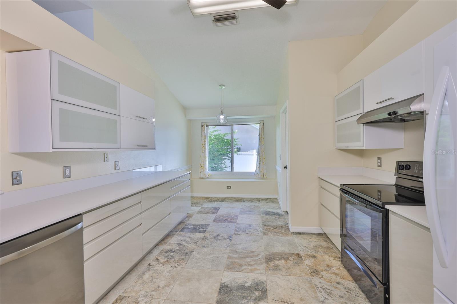 All new kitchen, looking to dinette with window bench